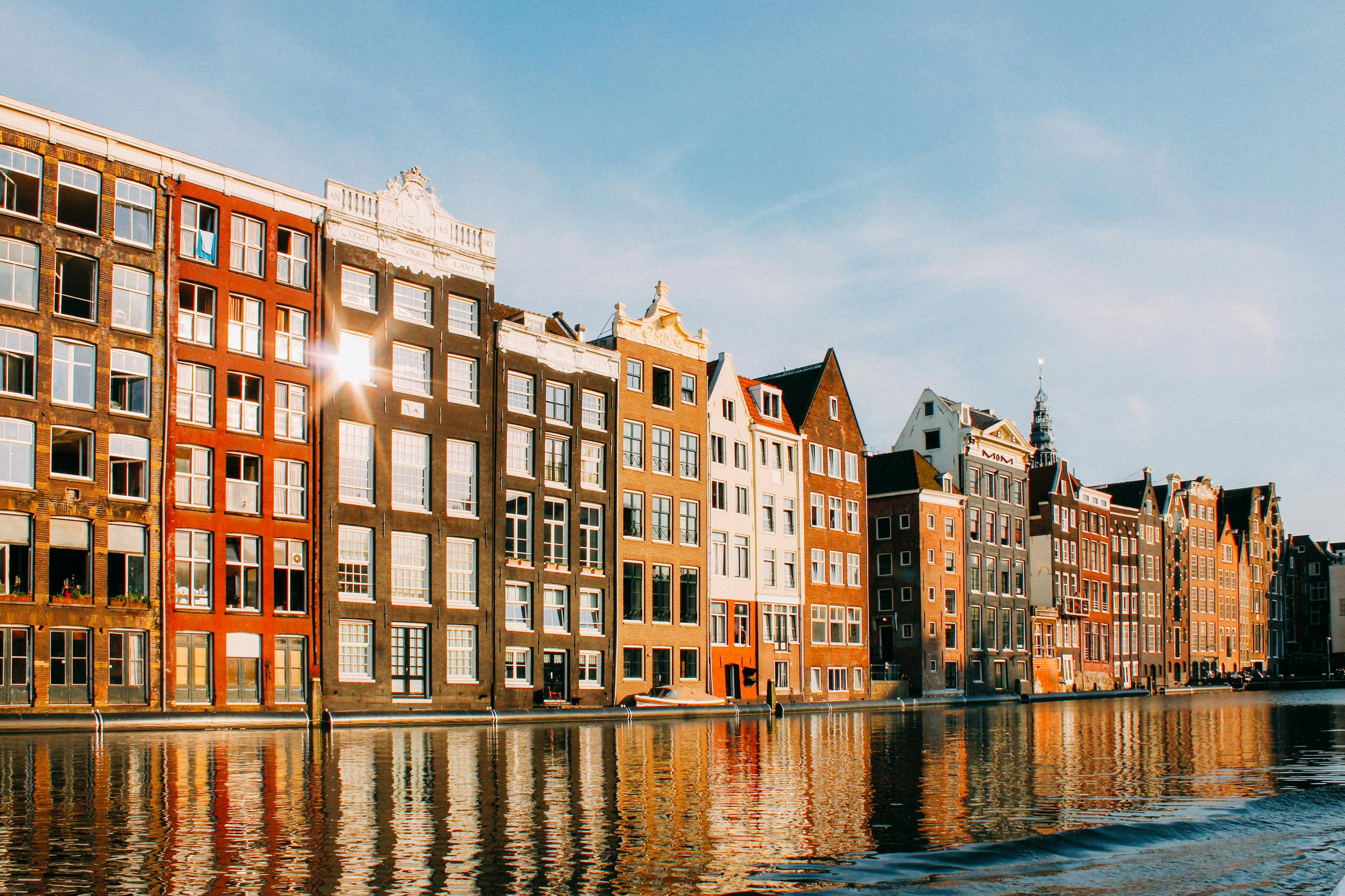 Angled photo of houses on a canal in Amsterdam